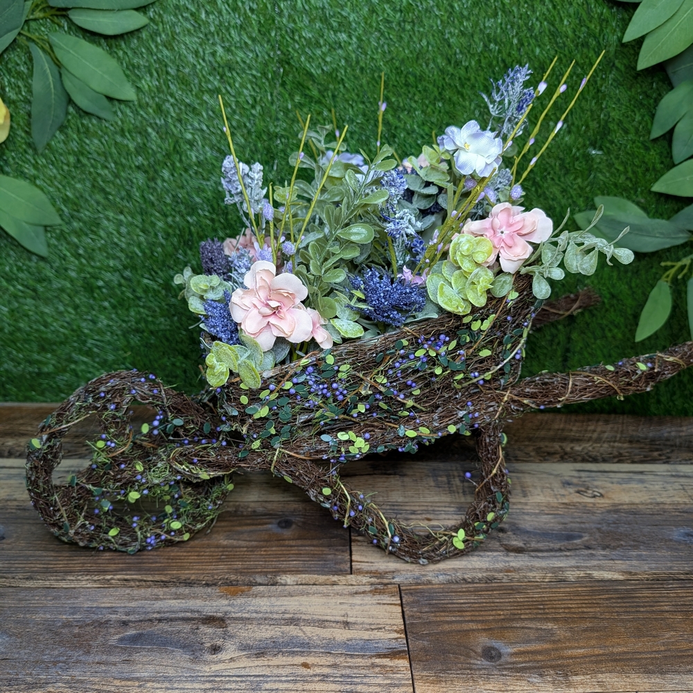 Charming Floral Wheelbarrow with Pink and Purple Accents